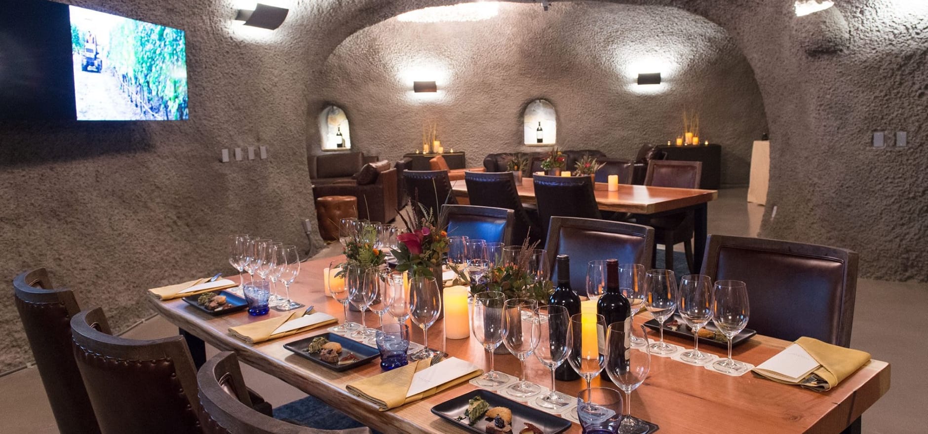 Elegant Napa Valley wine tasting room with crystal glasses and vineyard views - luxury wine tours from San Francisco