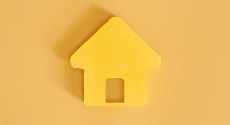 A yellow house-shaped object on a yellow background.