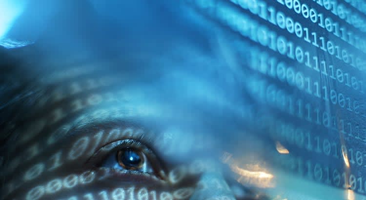 A close-up, artistic representation that blends a human eye with a digital overlay of binary code (sequences of ones and zeros). The scene is primarily blue-toned, giving it a high-tech, futuristic feel.