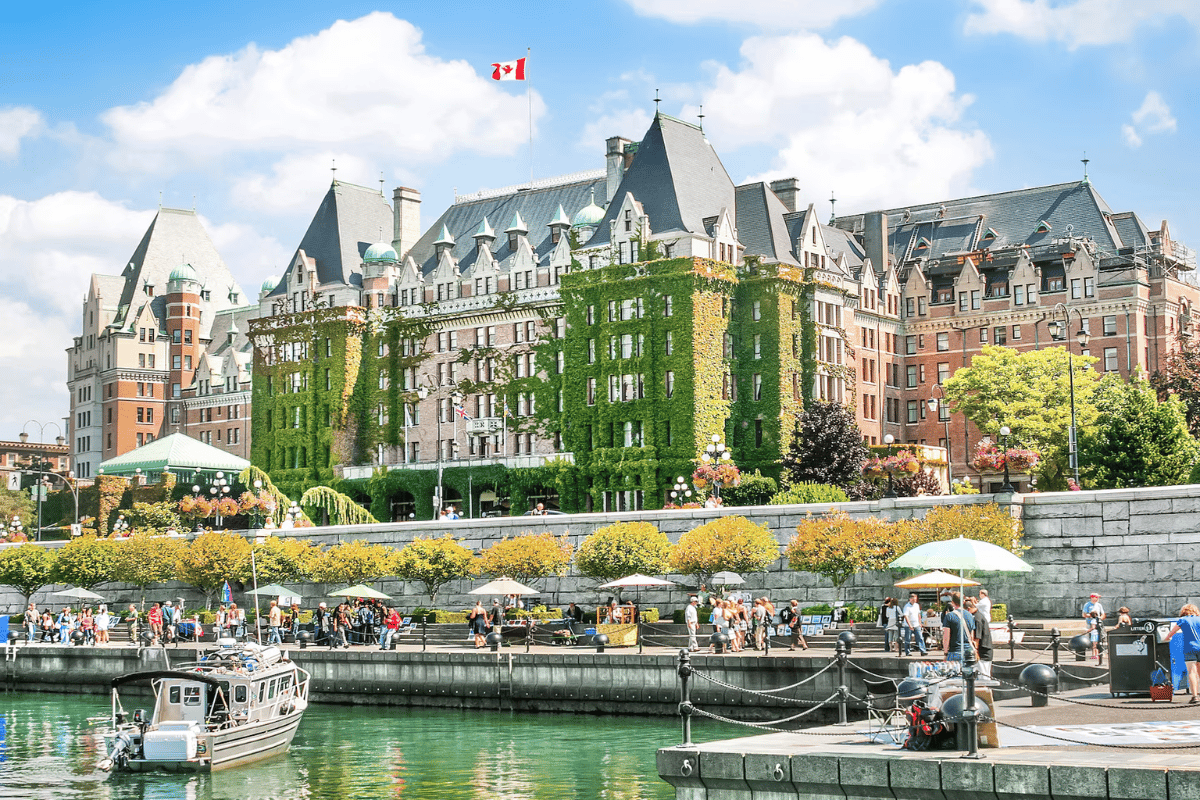 The iconic Fairmont Empress Hotel and bustling waterfront of Victoria’s Inner Harbour on a bright spring day.
