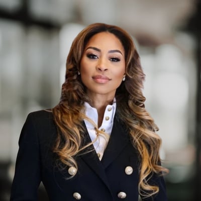 Dee Dee Abdur-Rahim in a black blazer and white blouse