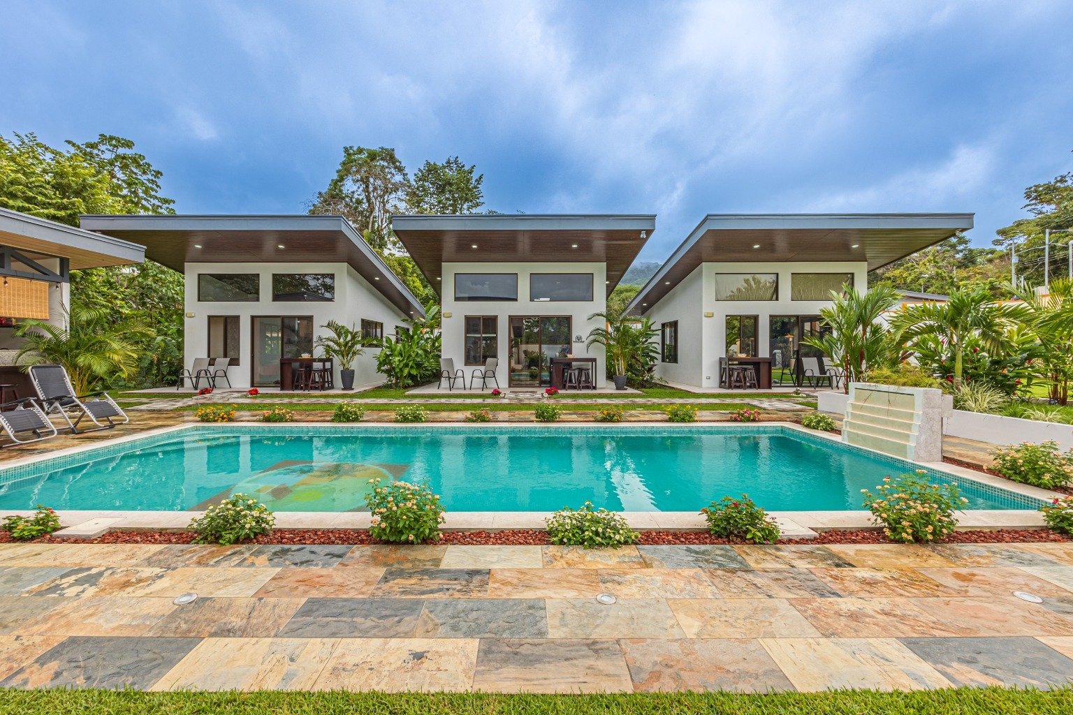 Incredible turnkey investment opportunity, 3 Rental villas, and a 2 Bedroom Home with a large pool.