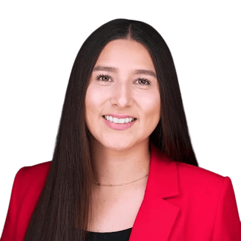 Monica Vigil smiling in a red blazer.