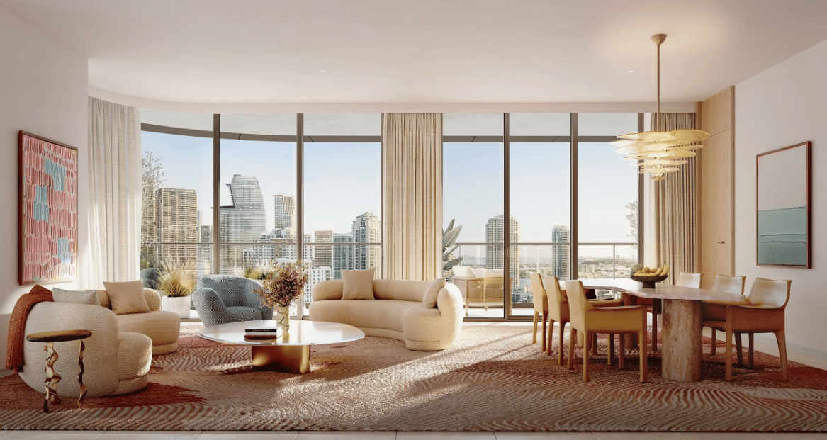 Luxury living and dining room with floor-to-ceiling windows overlooking Miami’s skyline.