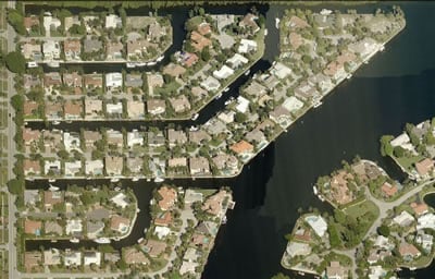 Aerial view of Golden Harbour homes, winding canals, and waterfront lots.
