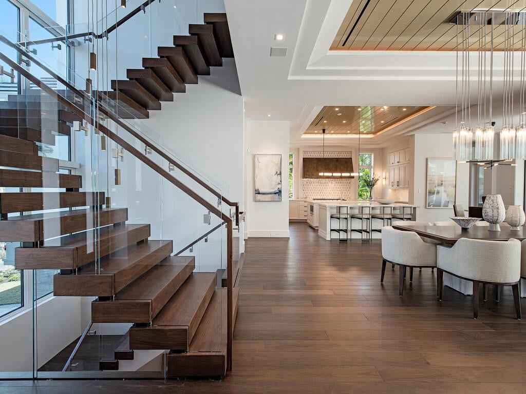 Walnut Flooring and Floating Staircase Naples Florida Luxury Home