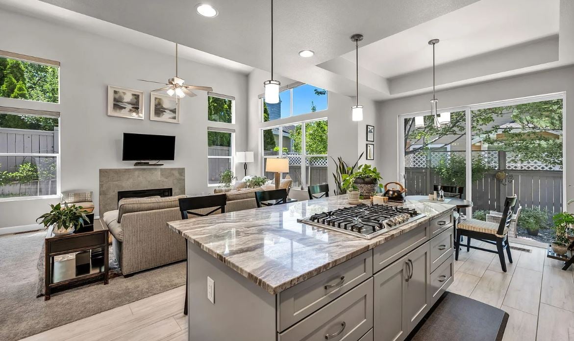 The main level primary suite offers ease and privacy, while the airy floor plan flows seamlessly for both everyday living and entertaining. Enjoy the convenience of newer appliances, quality finishes, and a truly move-in-ready experience.