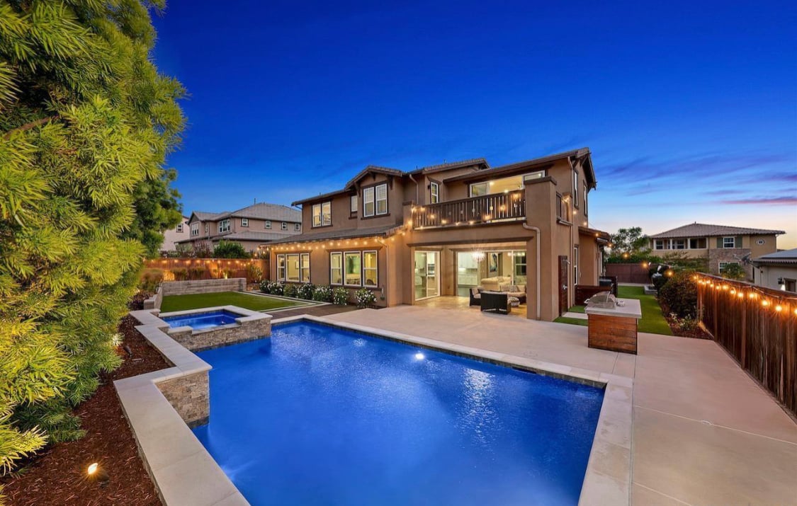 Ben Crosby with out of area buyer in new San Diego home.