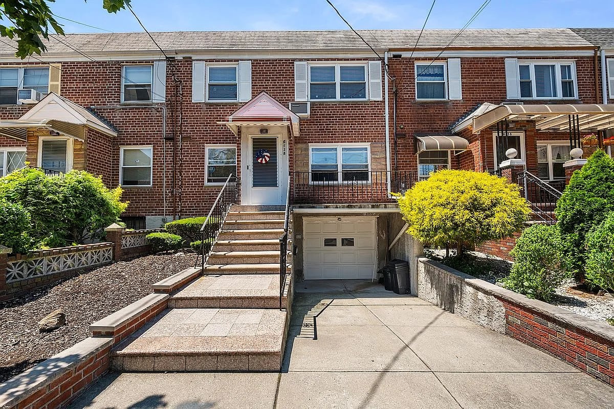 2-family brick home at 6138 71st St Middle Village Queens sold by The Parviz Team at Compass.