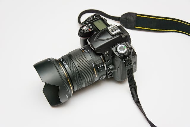 a-professional-canon-camera-sitting-on-a-table