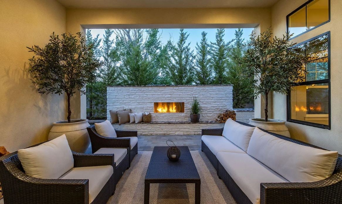 Covered outdoor patio with fireplace and views in 89511