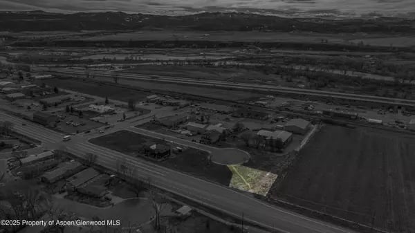 Aerial view of Silt with a roadside parcel highlighted against the monochrome town.