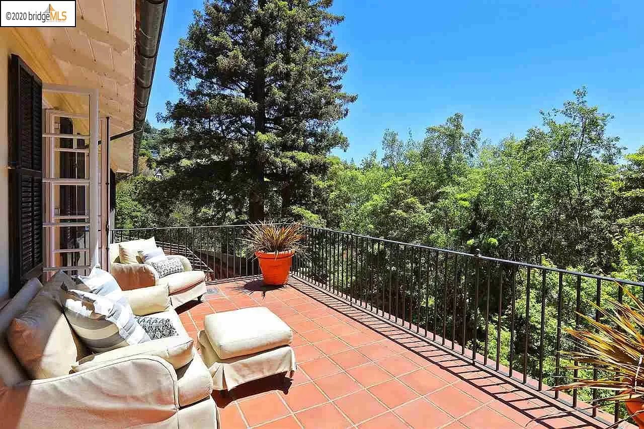 A Blue sky and big trees view on top balcony of a property in Piedmont CA