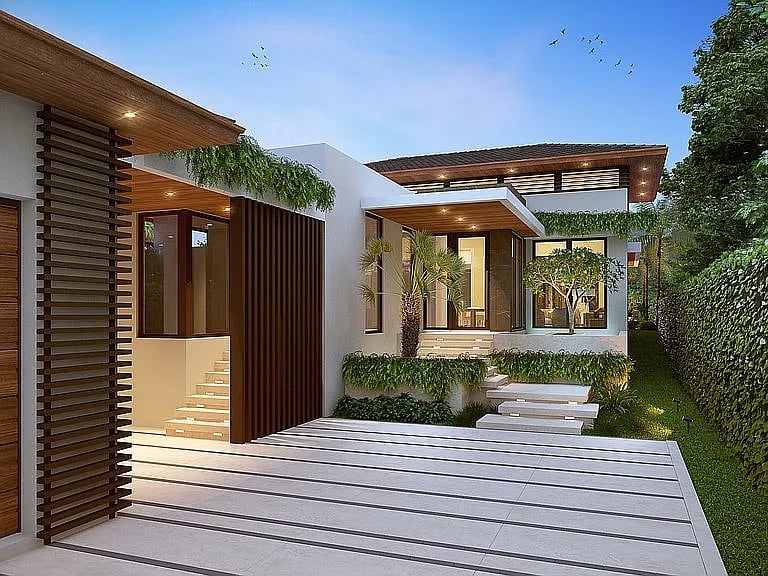 Modern white-and-wood home with a broad tiled terrace and landscaped entry at dusk.