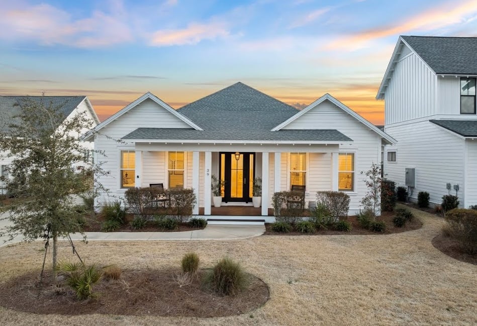 39 Firethorn Circle | Refined Coastal Retreat With Fenced Backyard And Multiple Porches