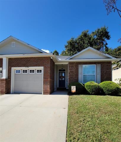 A modern single-story house in 2890 Hampton Meadow with a brick and siding exterior. The front yard is well-maintained with a driveway leading to a garage and some landscaping near the entrance.