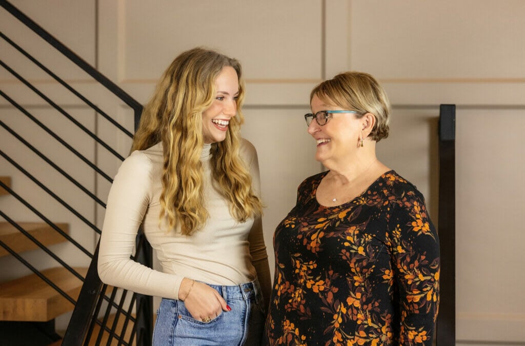 Grace Petty and Beth Ferester smiling at each other.