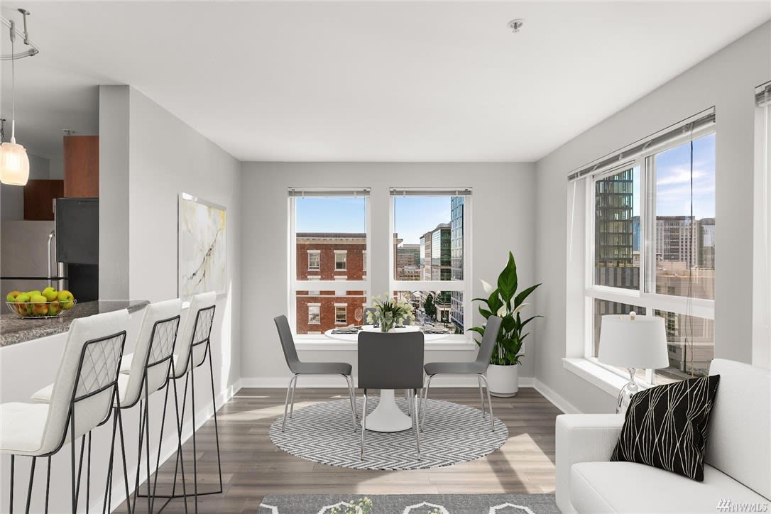 Elegant condo kitchen and dining space showcasing a sophisticated ambiance.