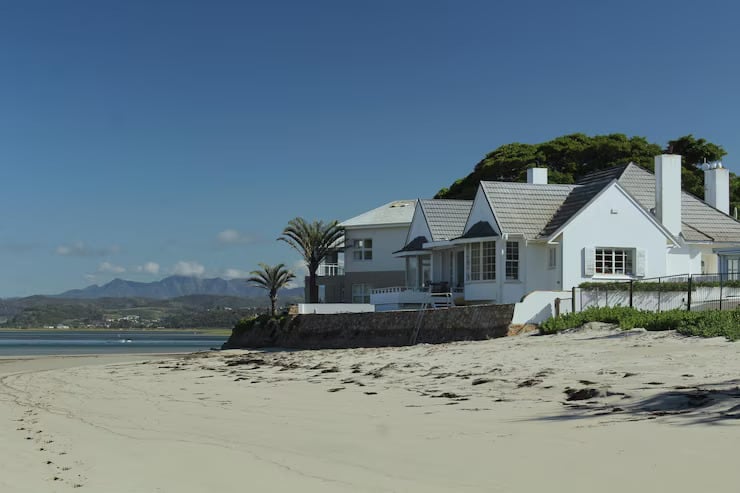 white beach house during low tide