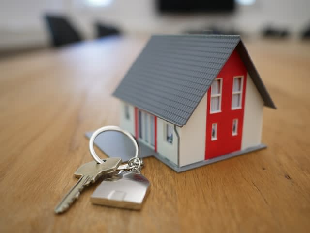 Alt tag: A small toy house and keys representing home safety tips.