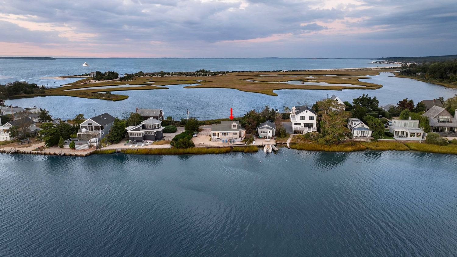 Panoramic Waterfront Vistas in a Coveted Harborside Neighborhood