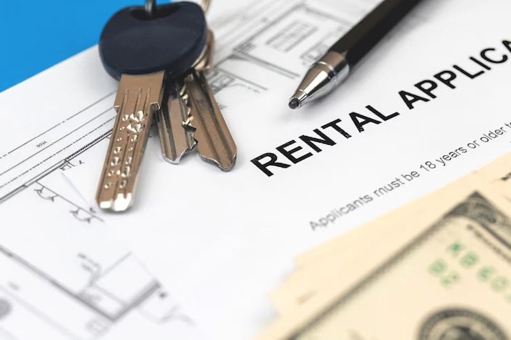 rental agreement document in office table pen house keys