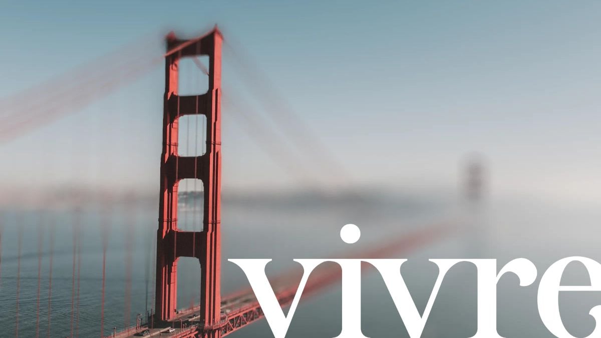 Blurry image of the Golden Gate Bridge in San Francisco real estate, with Vivre logo overlaid.