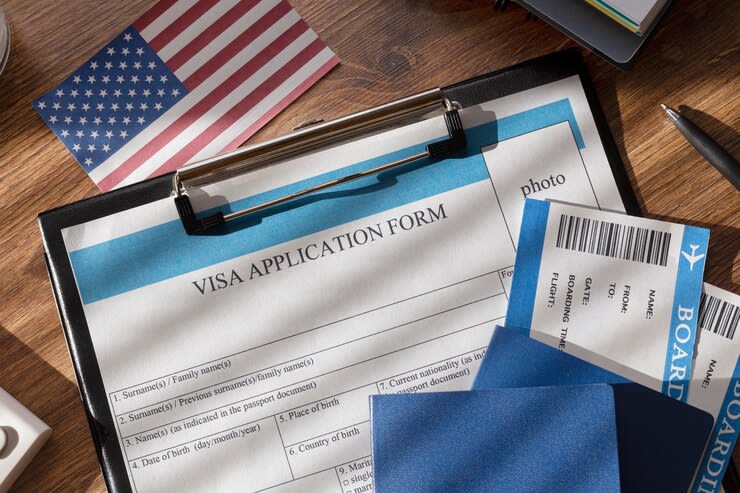 visa application form on a table with American flag