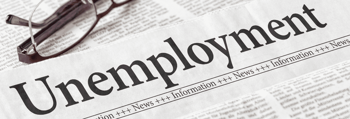 the word "Unemployment" prominently printed in a newspaper-style format, suggesting an emphasis on economic or labor market news.