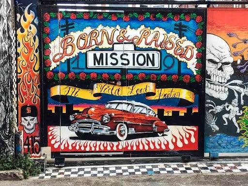 San Francisco mission district mural with a red car