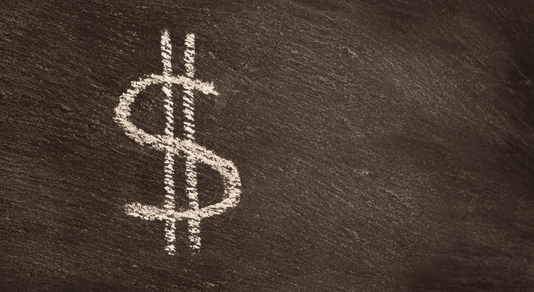 A chalk drawing of a dollar symbol ($) on a blackboard or dark surface.