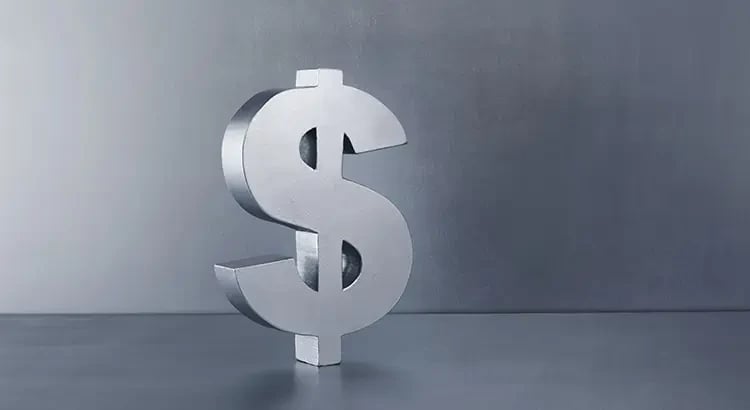 A large silver dollar sign on a gray background, symbolizing money or financial matters.