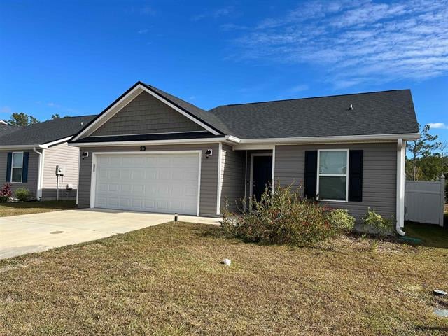 A single-story house in 4561 Rivers Landing Dr with a modern design, featuring a dark roof and light-colored exterior walls. The front yard is simple with minimal landscaping, mostly grass.