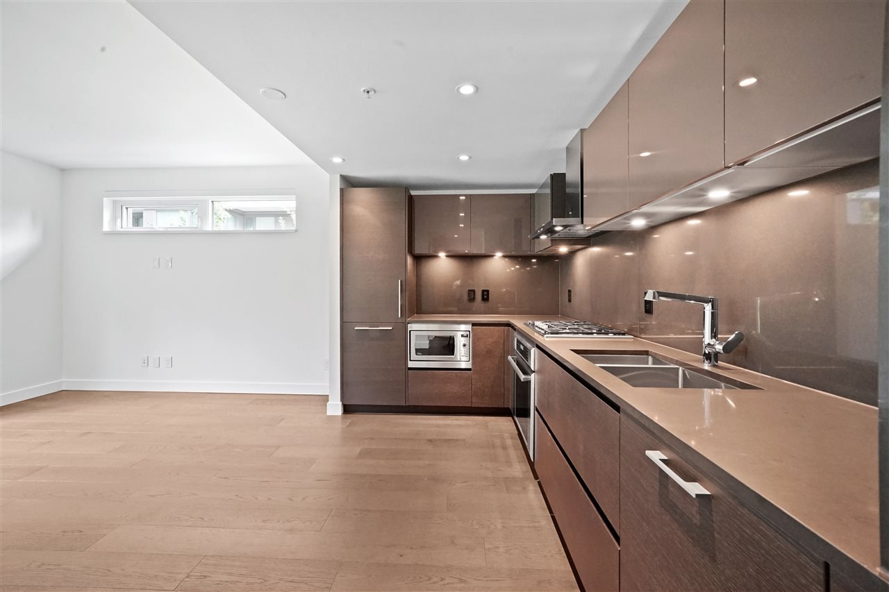 203-7128 Adera St