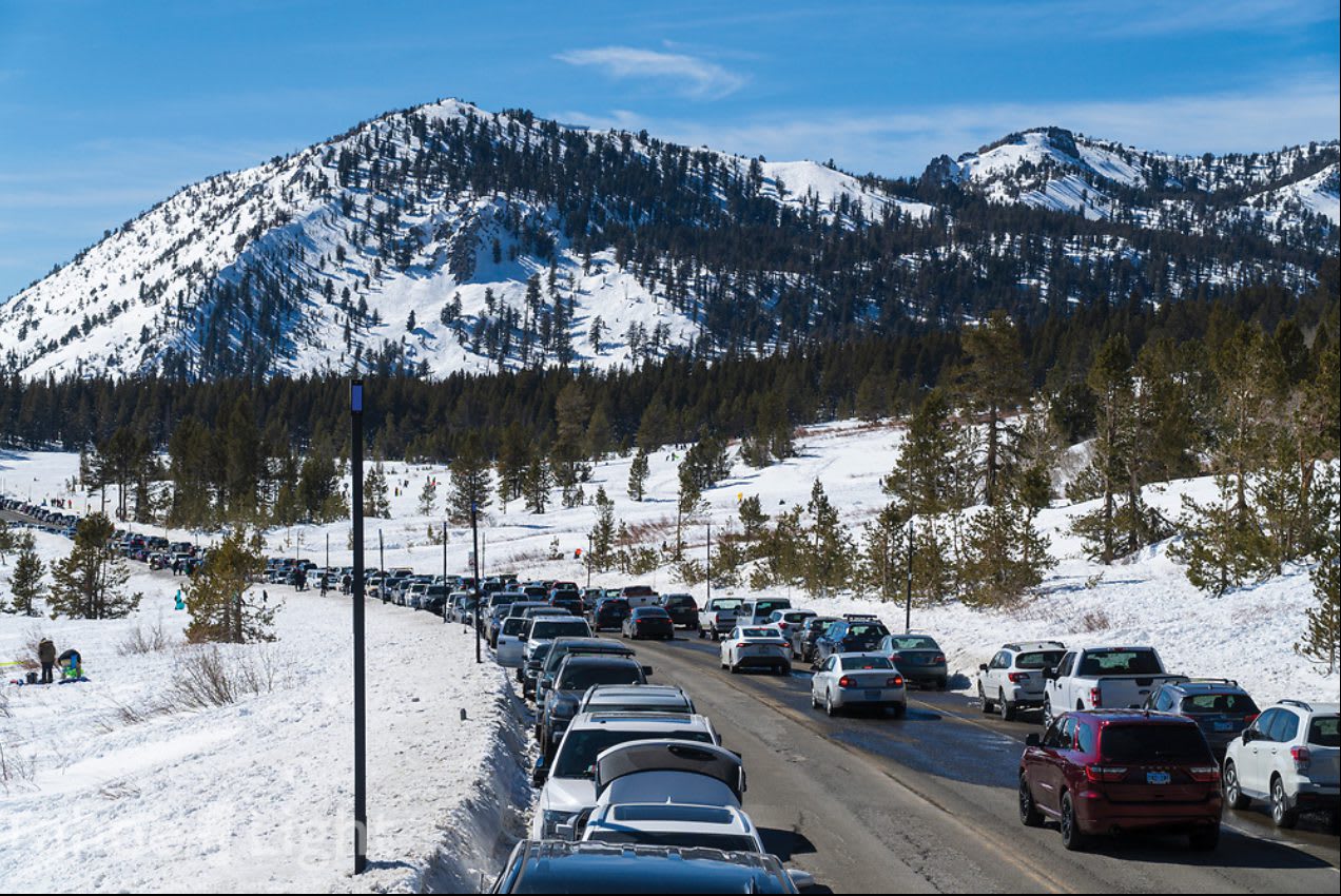 Cars line both sides of the road through Tahoe Meadows during a busy winter day in 2021, photo by Scott Sady