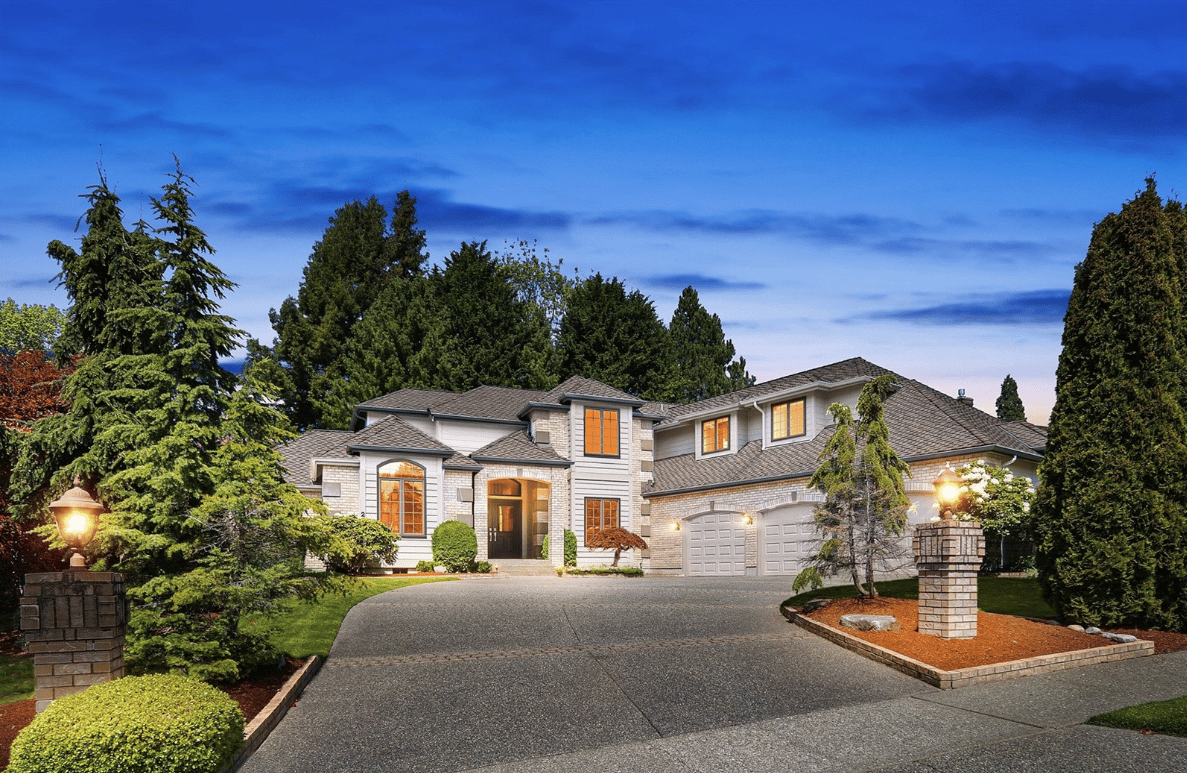 front view of cream home at dusk in normandy park