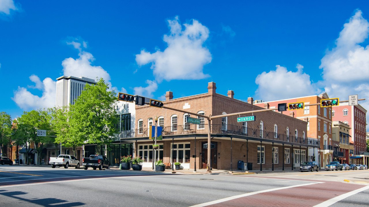 Intersection in a downtown area featuring a mix of historic and modern architecture. 