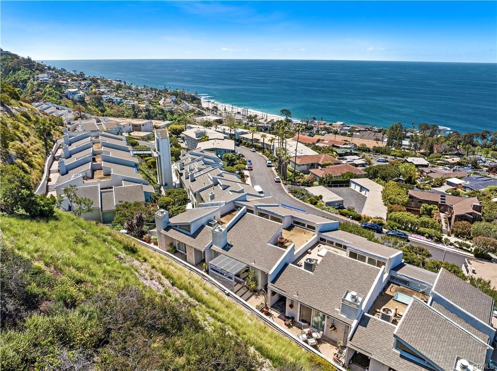 Coastal homes on a hillside overlooking the Pacific Ocean.