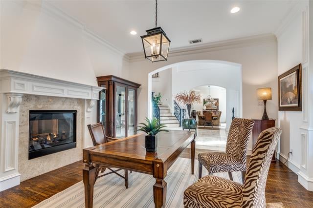 Dining room with a wood table, zebra-patterned chairs, and a fireplace.