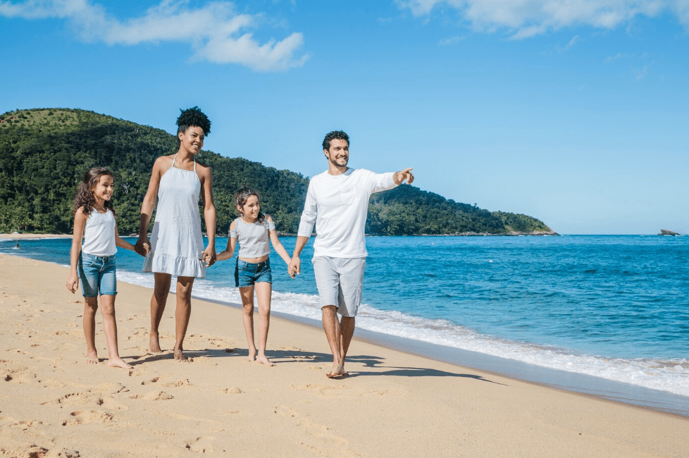 a family strolling in the beach