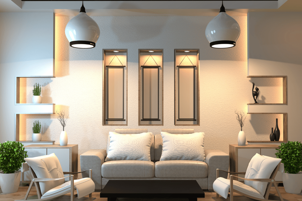 Living room with a neutral sofa, built-in display niches, and two pendant lights.