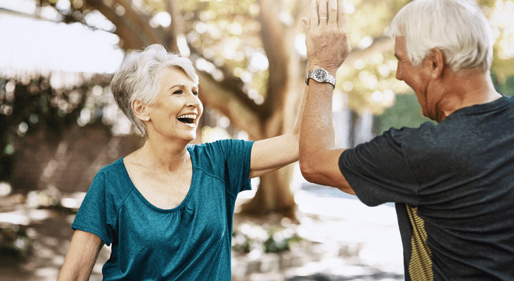couple high-fiving and smiling