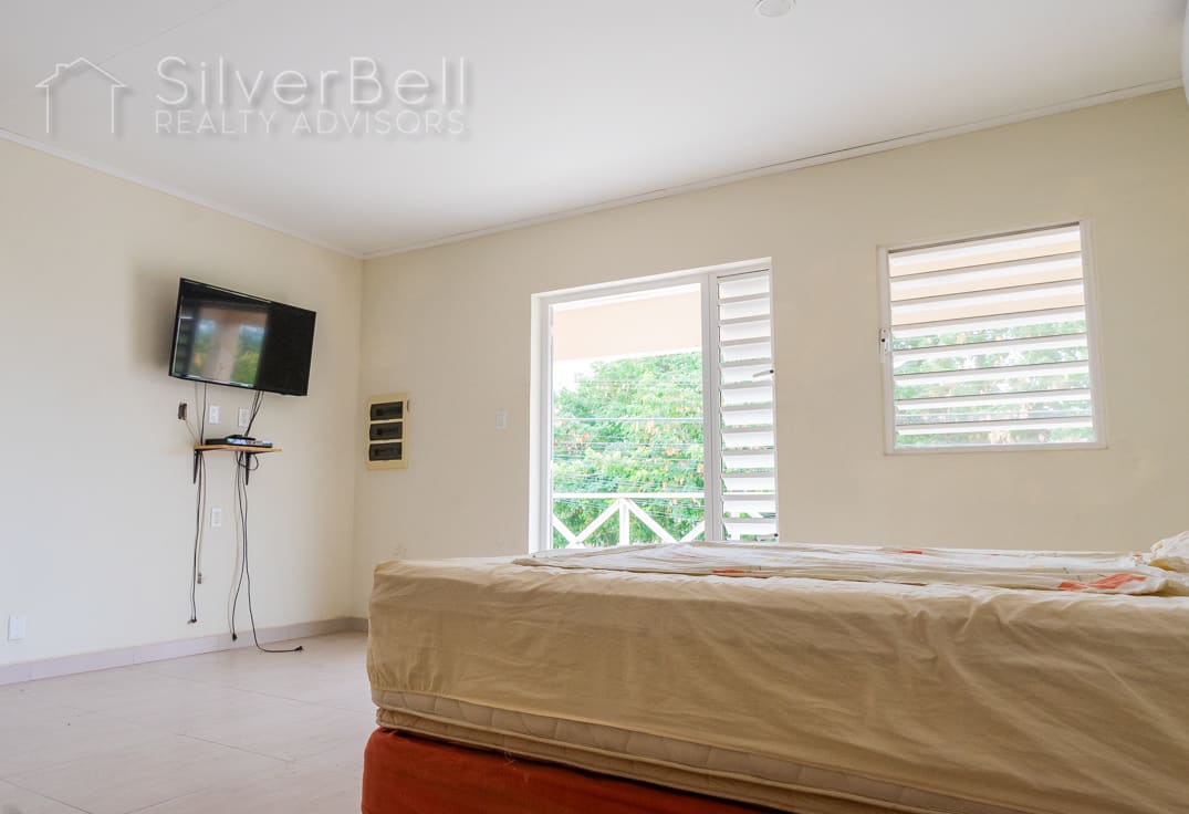 Welcome to this fully furnished apartment, located in Amandelweg, Dominguito, Curaçao where every bedroom is equipped with air conditioning and 5 minutes away from Mambo Beach. SilverBell Realty Advisors - Curaçao