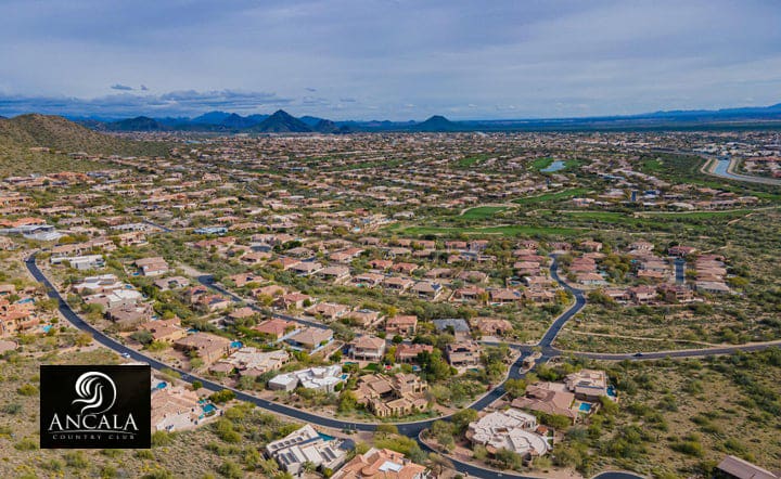 Aerial view of a residential neighborhood with mountains