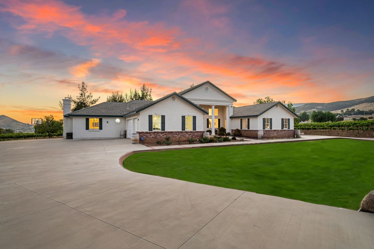 Charming 5-bedroom house surrounded by lush vines at a Los Angeles winery estate for sale.