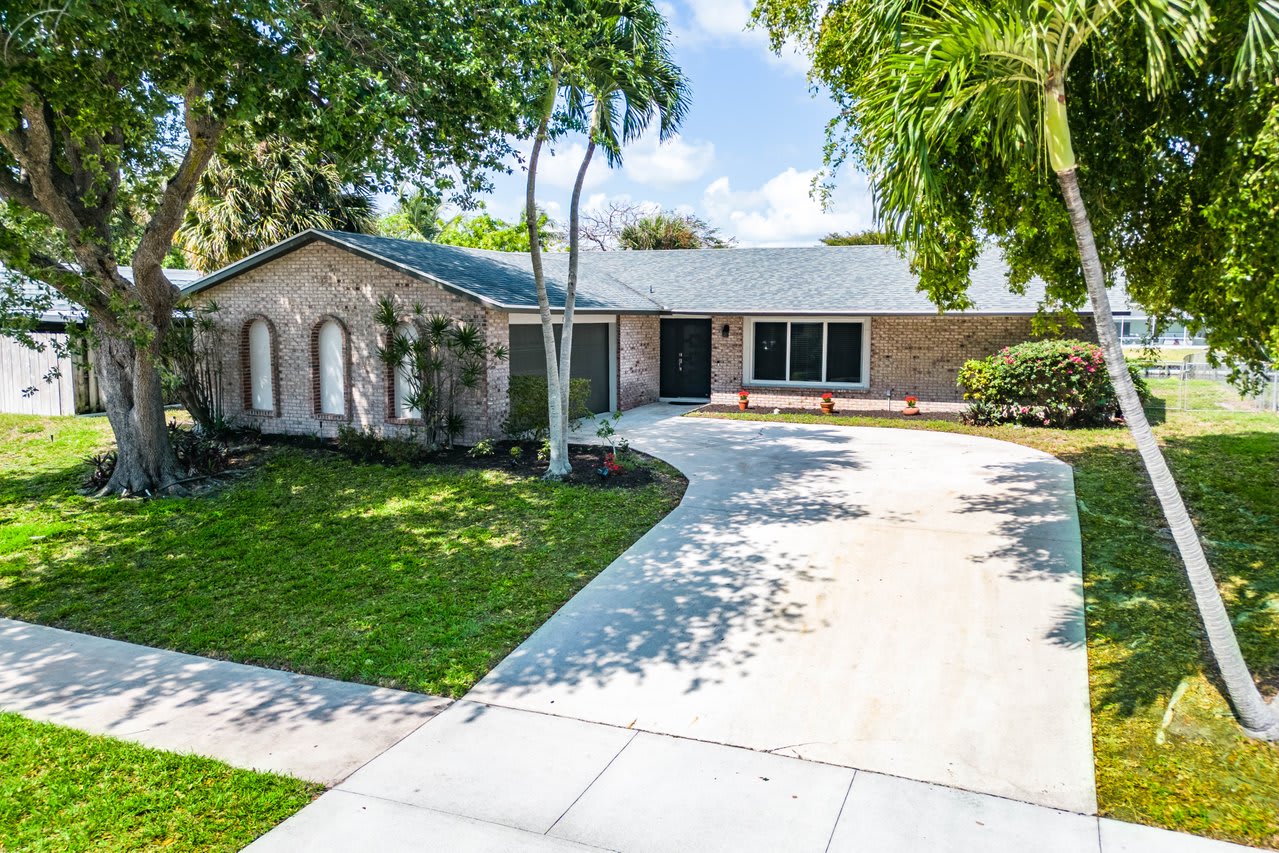 Front Yard of 1713 W Terrace drive, single family home in Lake Worth Beach listed by Nathan Zieman and the Corcoran Group.