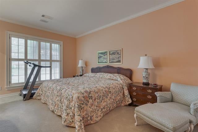 Bedroom with a floral bedspread, white-shuttered window, treadmill, and cushioned chair.