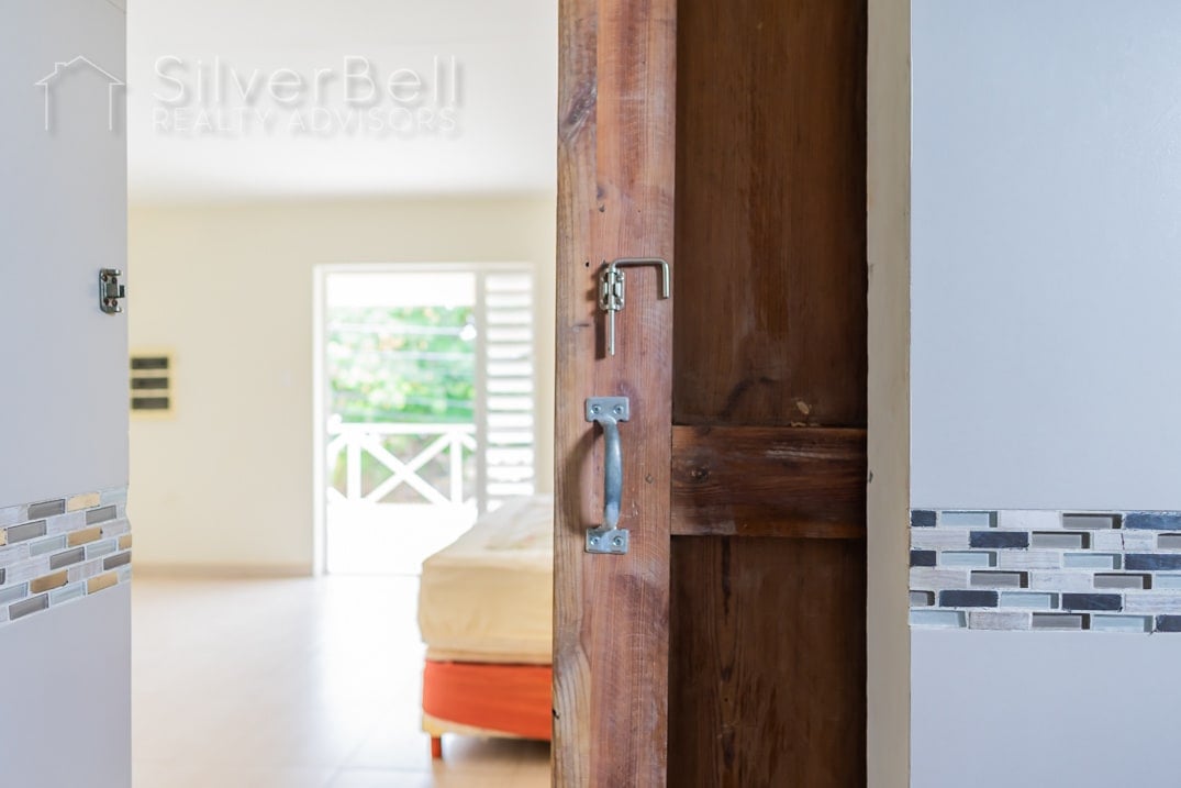 Welcome to this fully furnished apartment, located in Amandelweg, Dominguito, Curaçao where every bedroom is equipped with air conditioning and 5 minutes away from Mambo Beach. SilverBell Realty Advisors - Curaçao