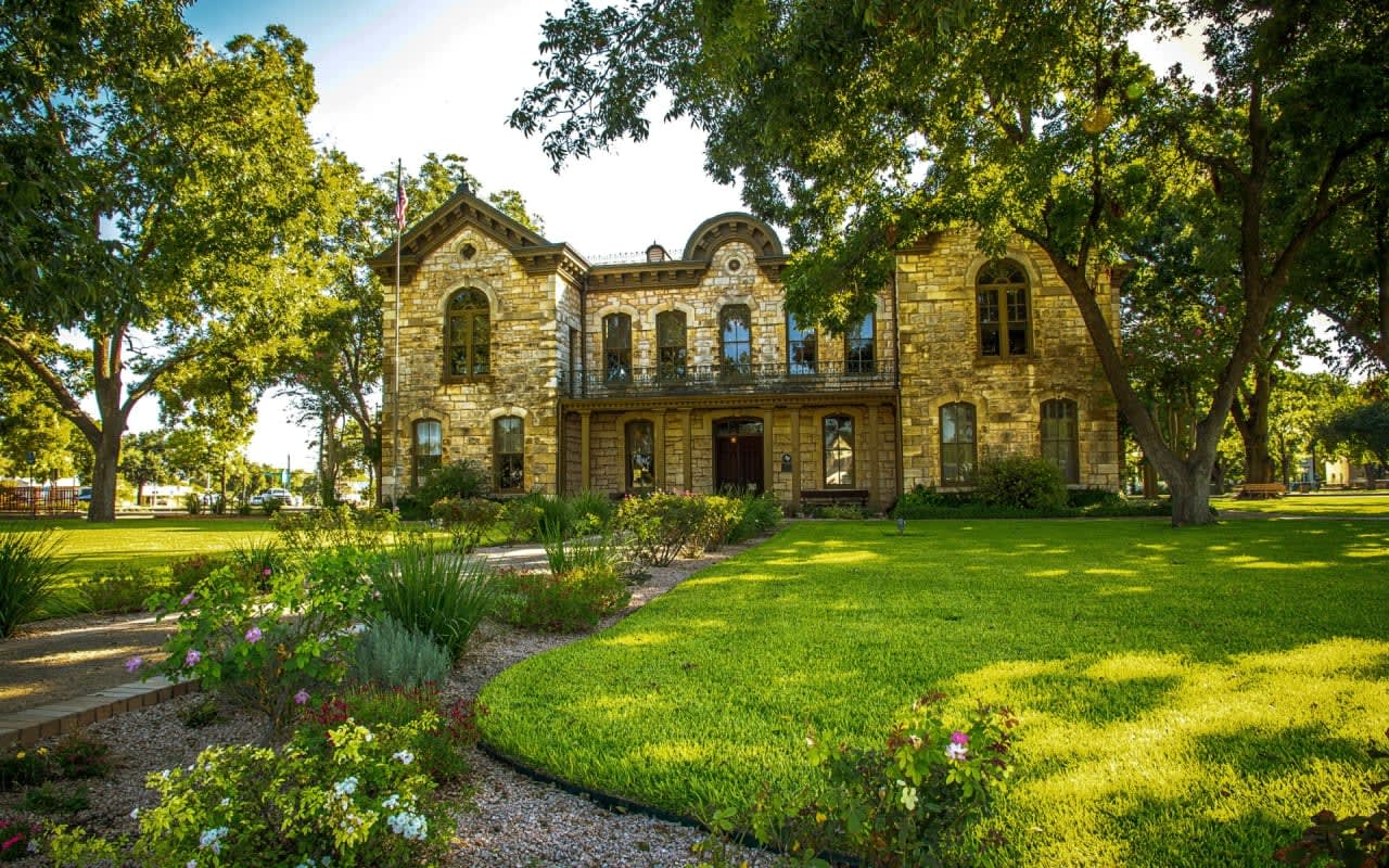 county home with lawn