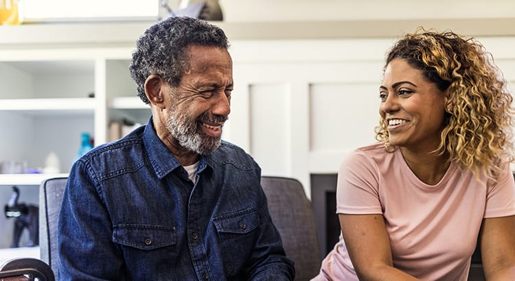 An image of two people (a man and a woman) having a conversation, likely related to financial or real estate advice.